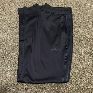 Adidas jogger pants. Black with black stripes. Adult medium. Never worn.